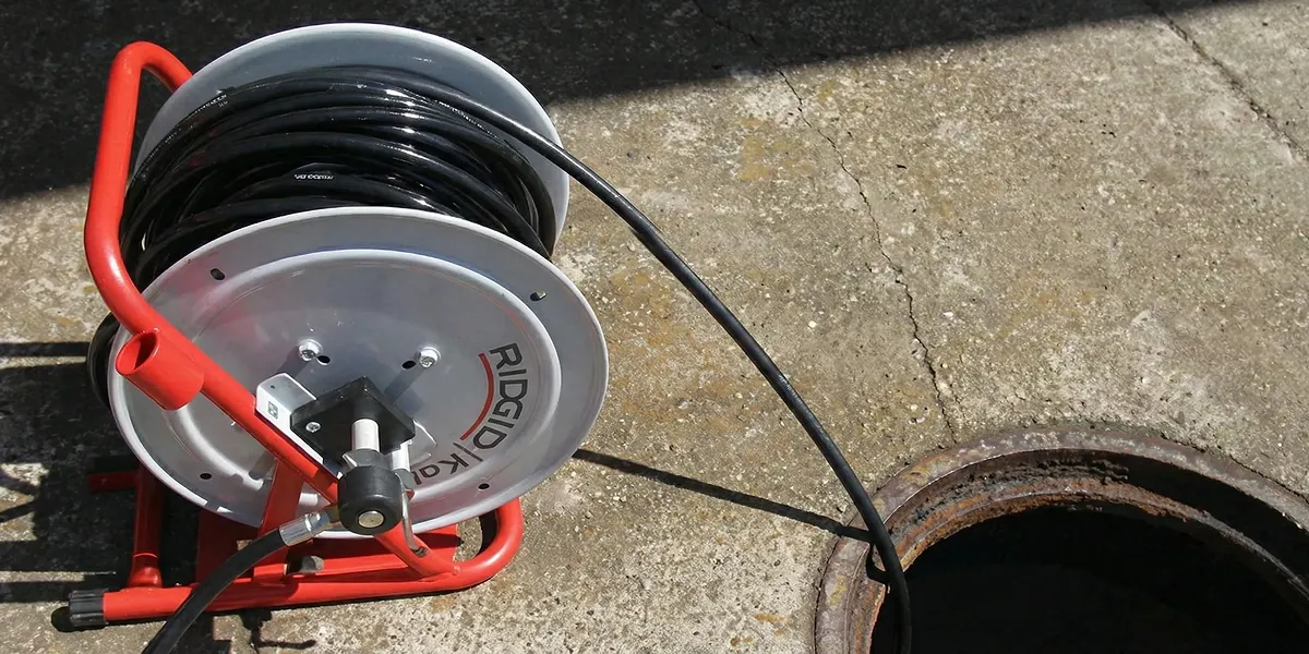 sewer rodding equipment prepared to clear clogged sewer lines in Charlotte, NC
