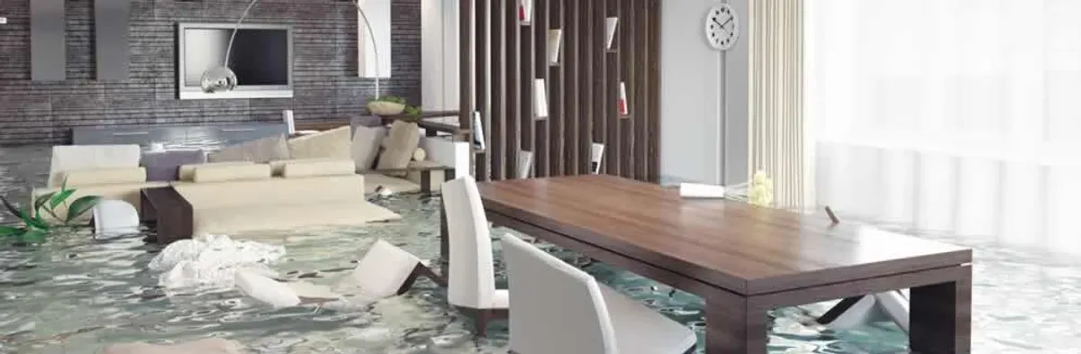 home interior affected by water damage with flooded floors and displaced furniture in Charlotte, NC